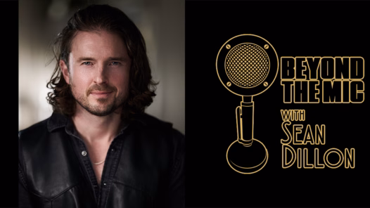 John Bregar, with long dark hair and a black leather vest, beside the gold Beyond the Mic with Sean Dillon microphone logo on black.